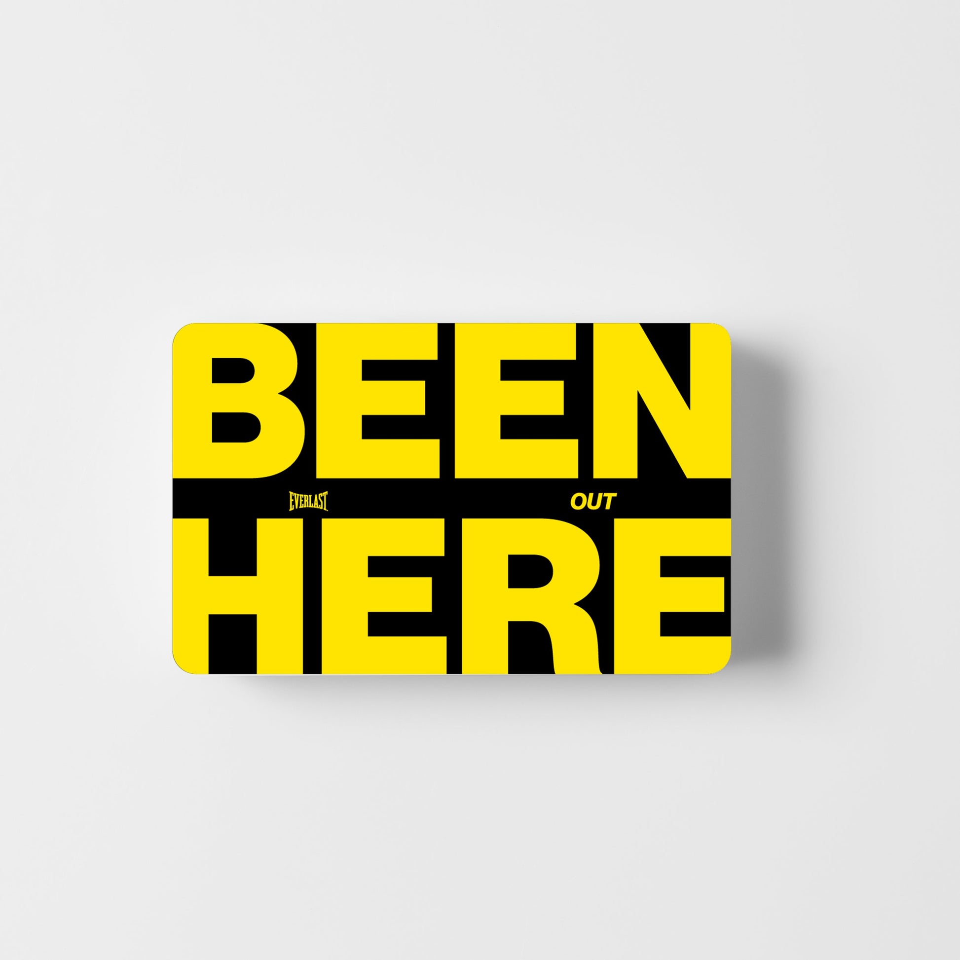Yellow card with ' BEEN HERE ' text on a black background