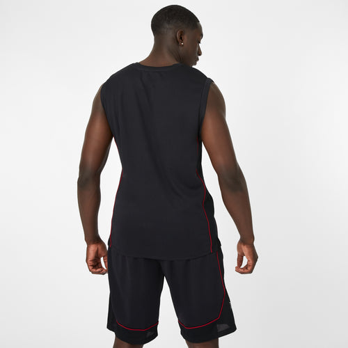 Man wearing a black sleeveless shirt and shorts with red accents on a white background