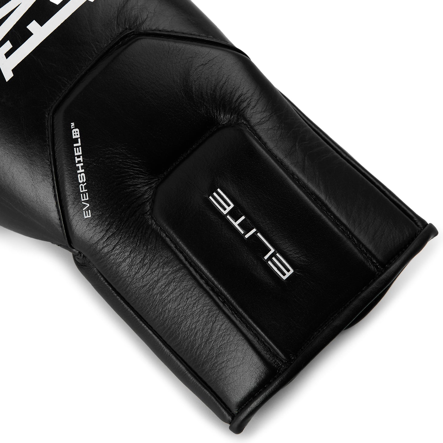 Close-up of a black leather boxing glove showing the wrist strap with 'ELITE' and 'EVERSHIELD' branding in light on a clear background.
